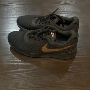 Nike Woman’s sneaker. Black with Rose Gold swoosh